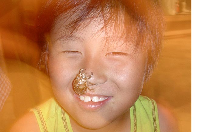 Kid with Insect at Party